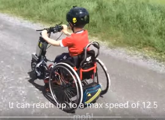 Childrens wheelchair power attachment